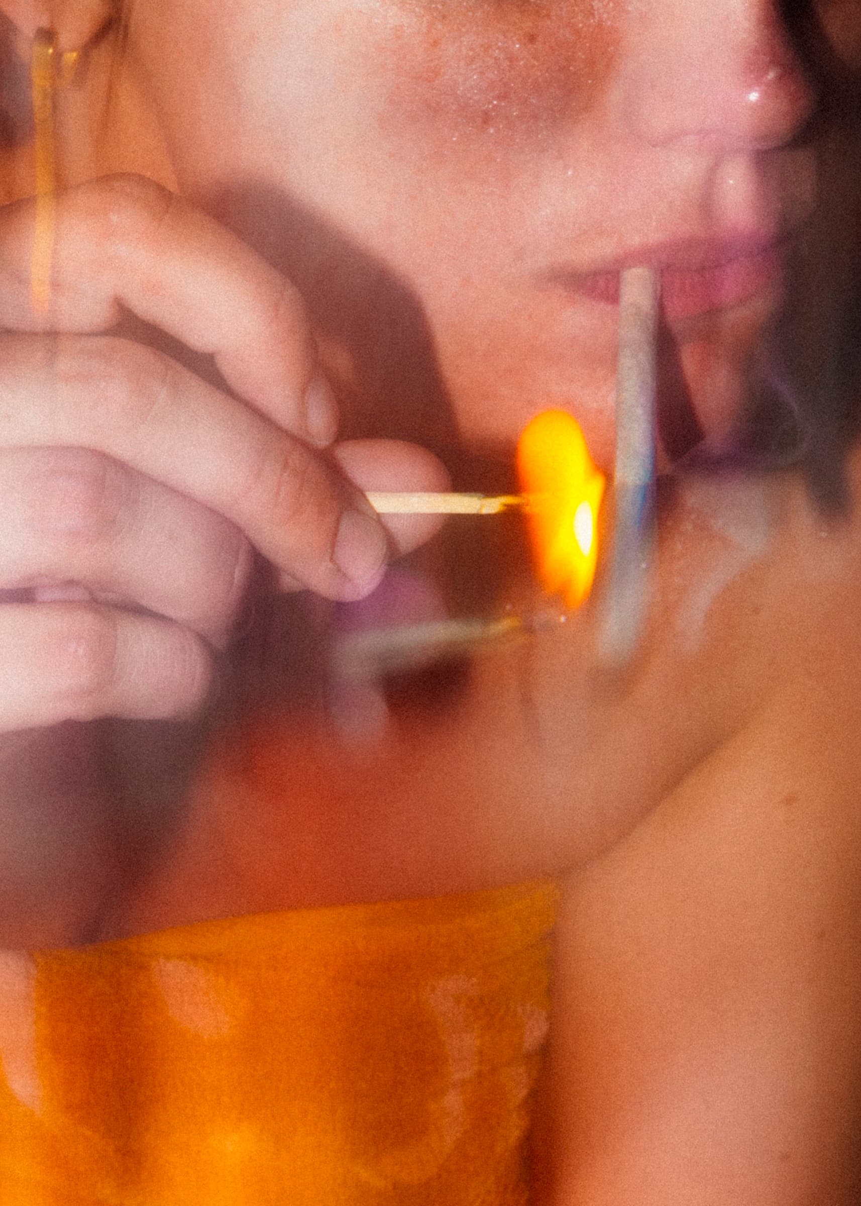 Lighting a joint with a match, close up